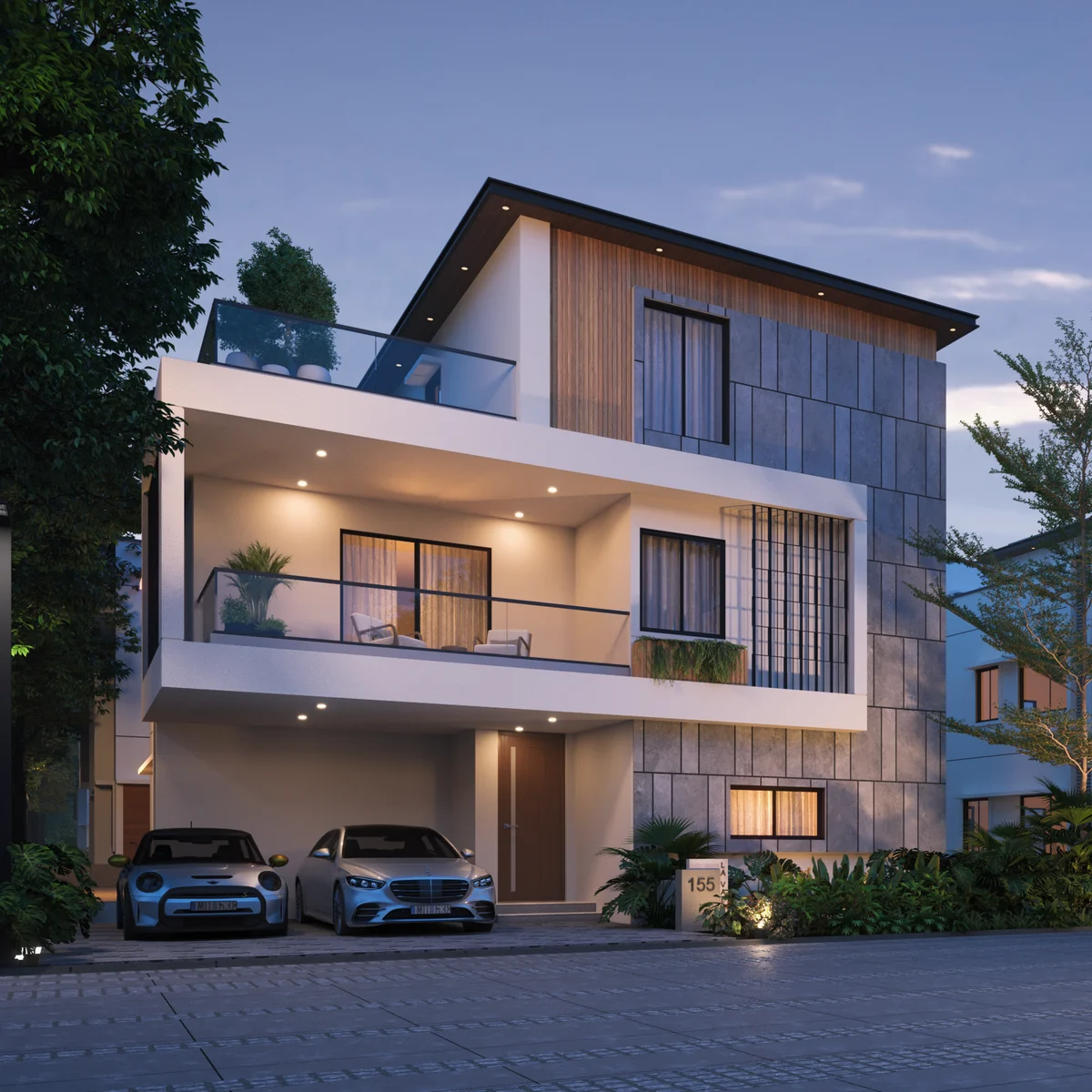 Revasa Là Valora G+2 villas at dusk with stone-clad and timber-slatted facades, glazed balconies and parking at the front of each plot Revasa Là Valora G+2 villas at dusk with stone-clad and timber-slatted facades, glazed balconies and parking at the front of each plot